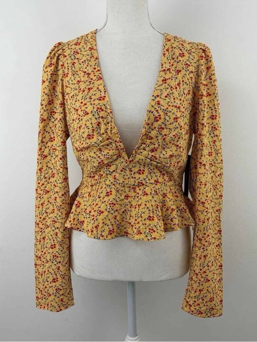 Lulu's Yellow Floral Deep V-Peplum Long Sleeve Top